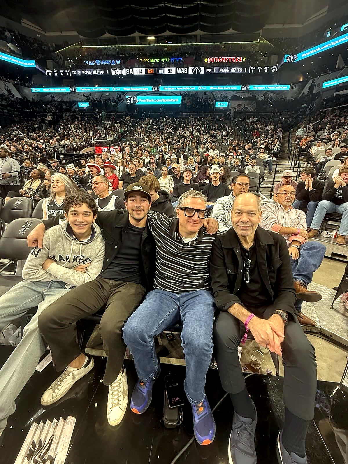 Andrew Hillman with others at a basketball game.