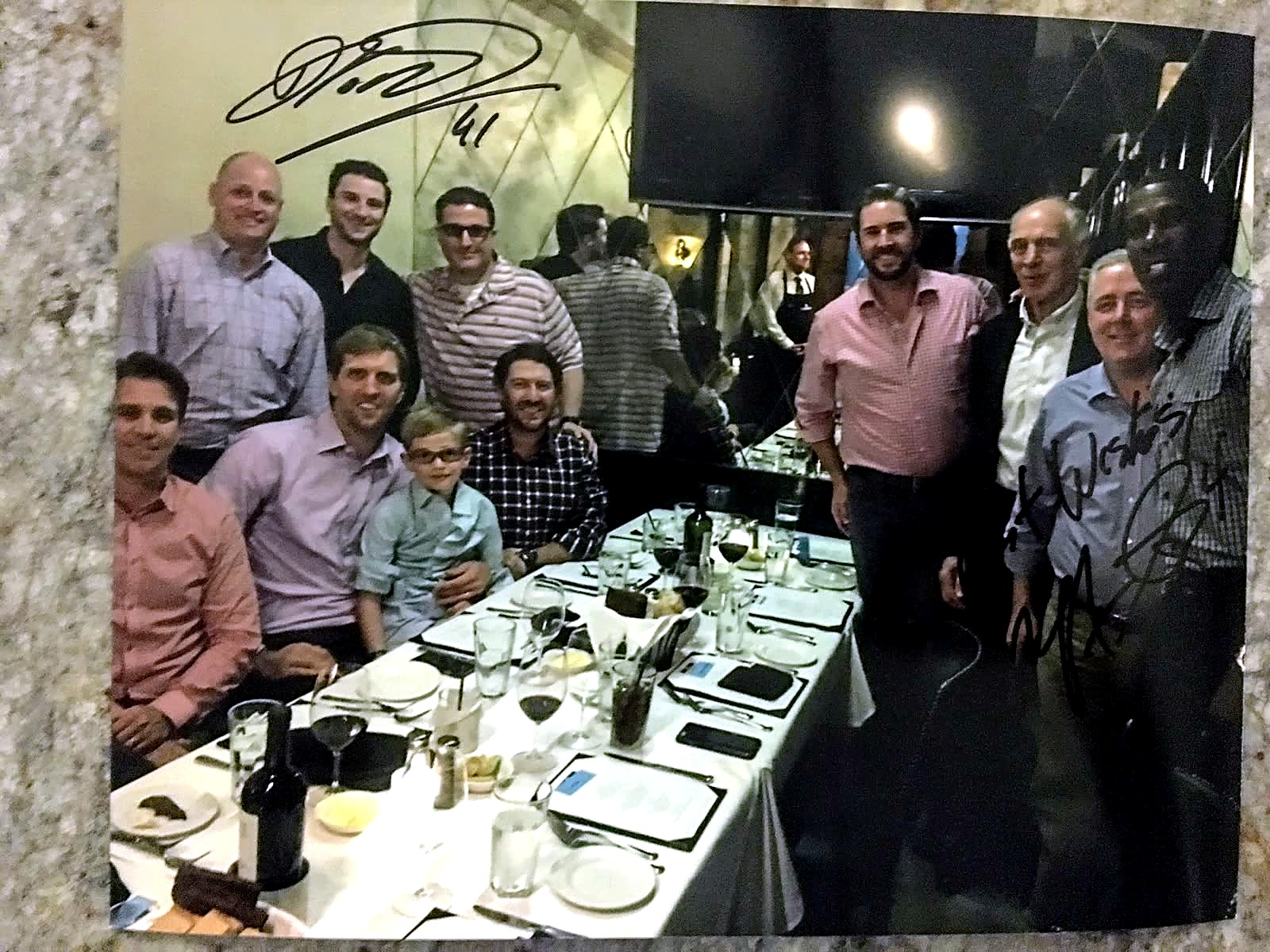 Andrew Hillman with others at a dinner.