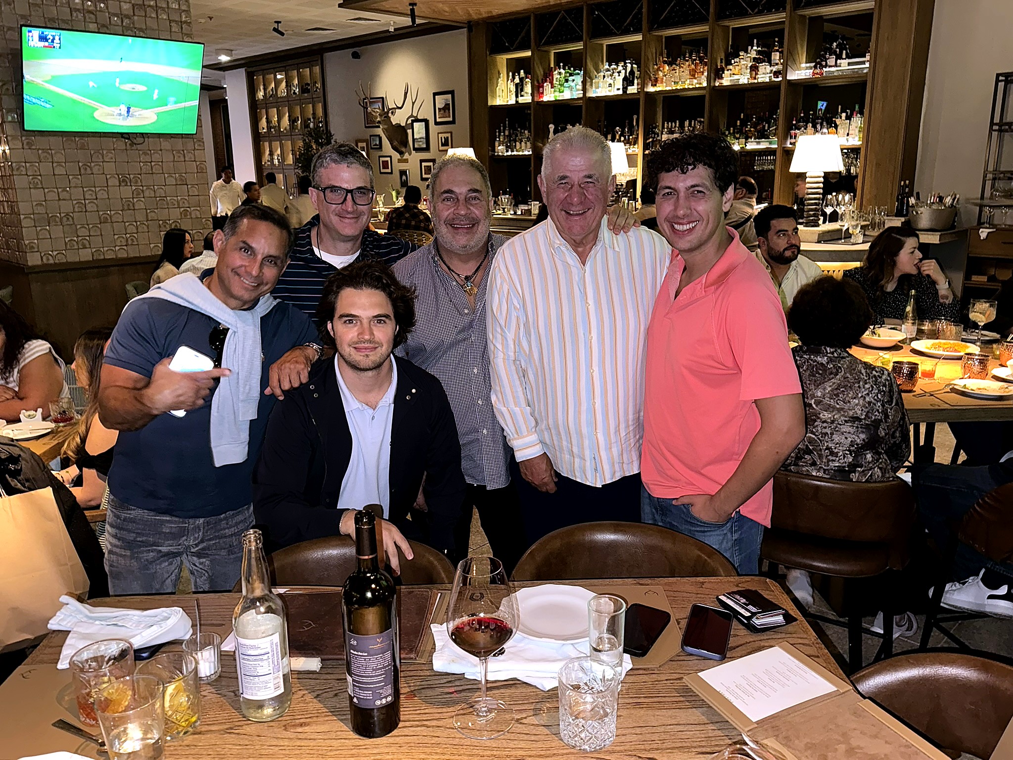Andrew Hillman with friends at a restaurant